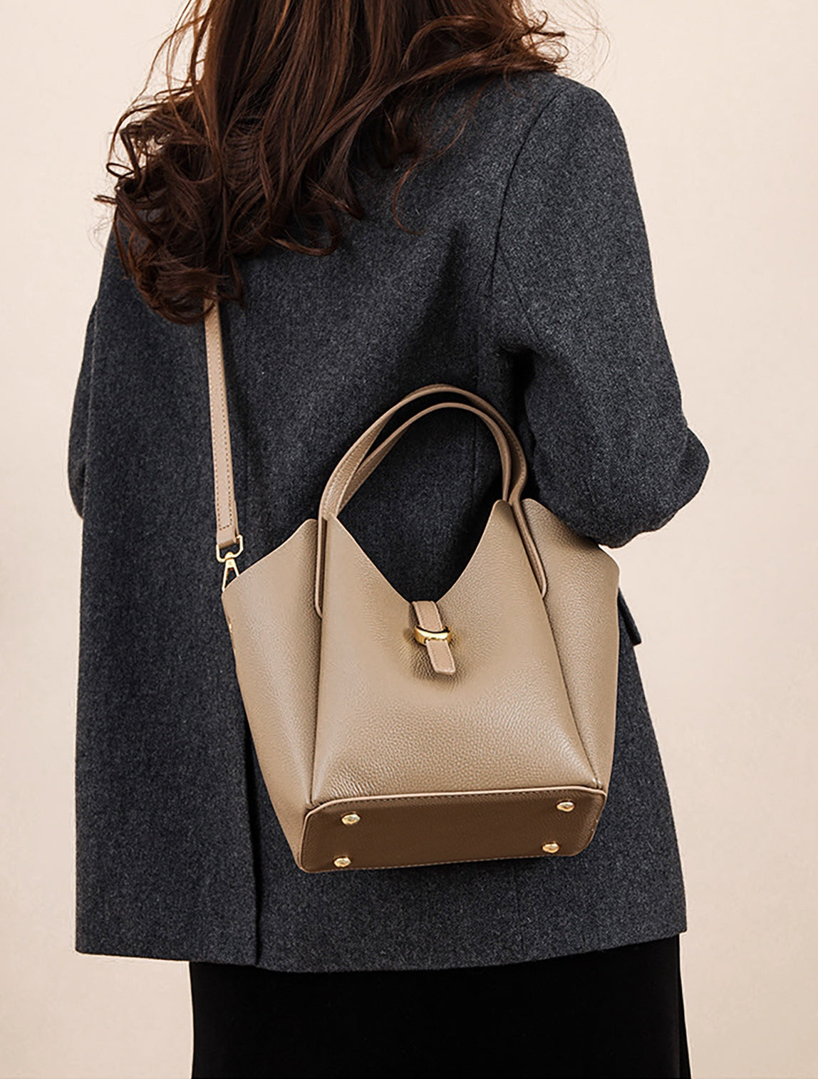 Lifestyle—leather bucket bag styled with a blazer