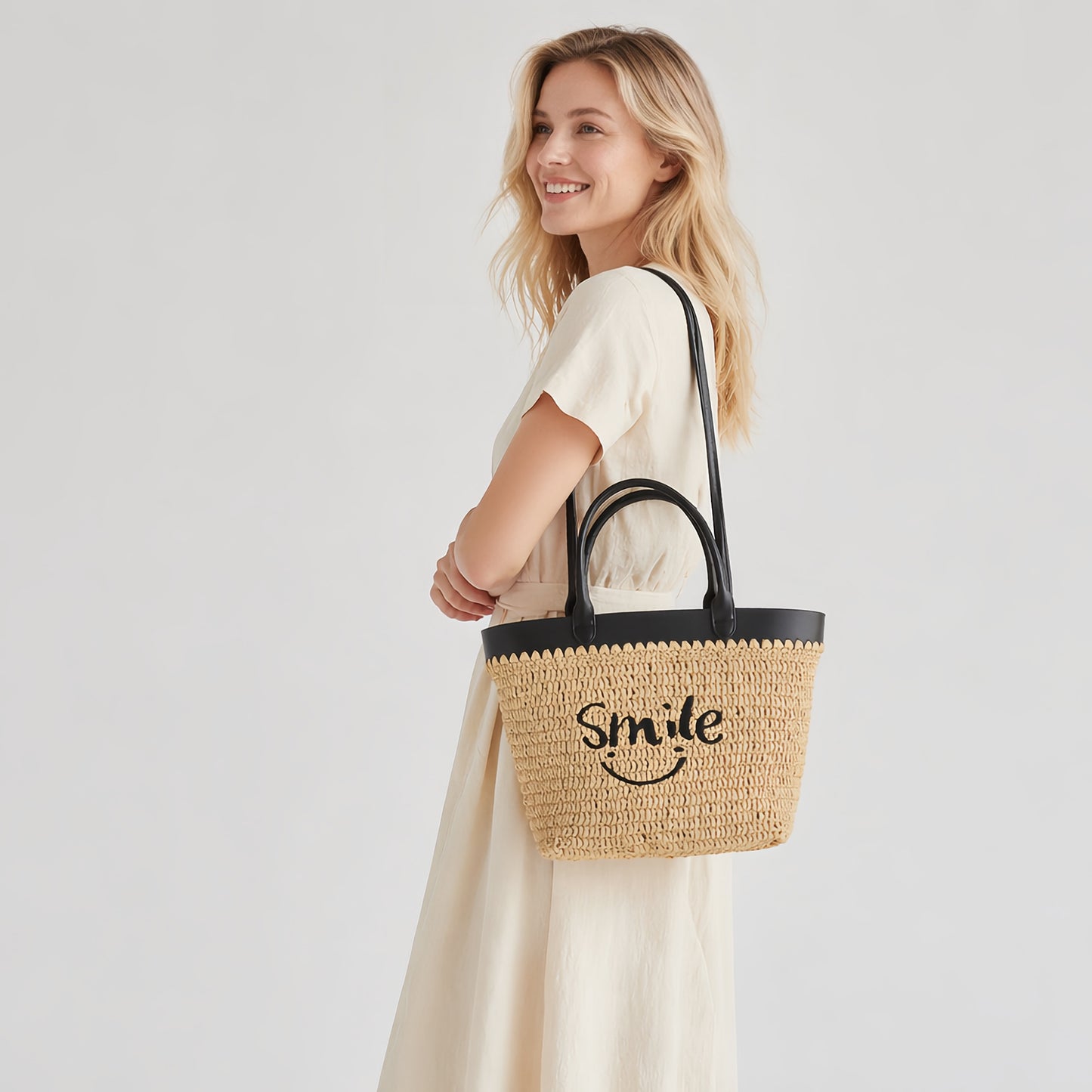 Woman carrying smile embroidered straw tote bag for summer outfit