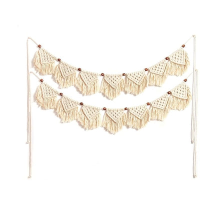 Eiyye 7-flag handmade macrame tassel garland in beige hung on wall