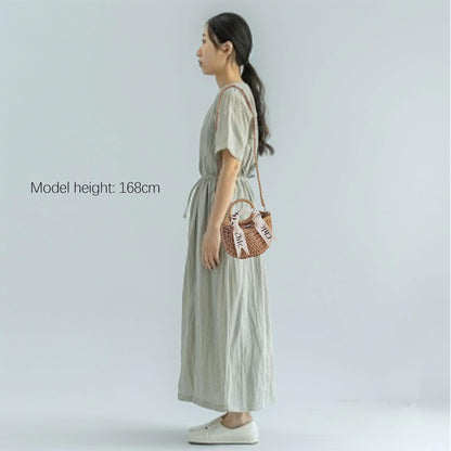 Eiyye beige straw tote styled with summer dress, over shoulder