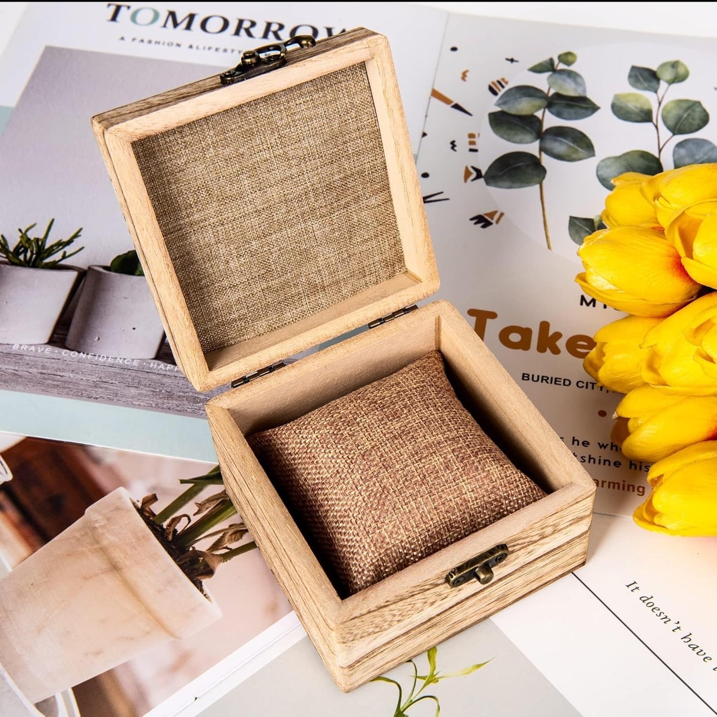 Inside view of wooden jewelry box with watch pillow