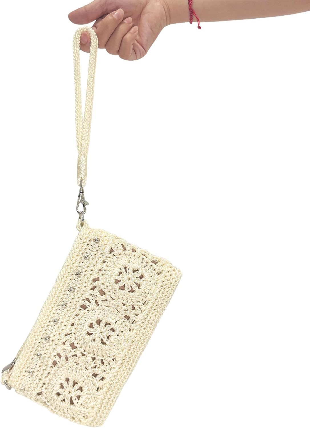 Light Yellow Crochet Wristlet Wallet carried by its wrist strap for a compact everyday look
