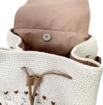 Backpack top detail featuring its textured crochet pattern and secure closure design