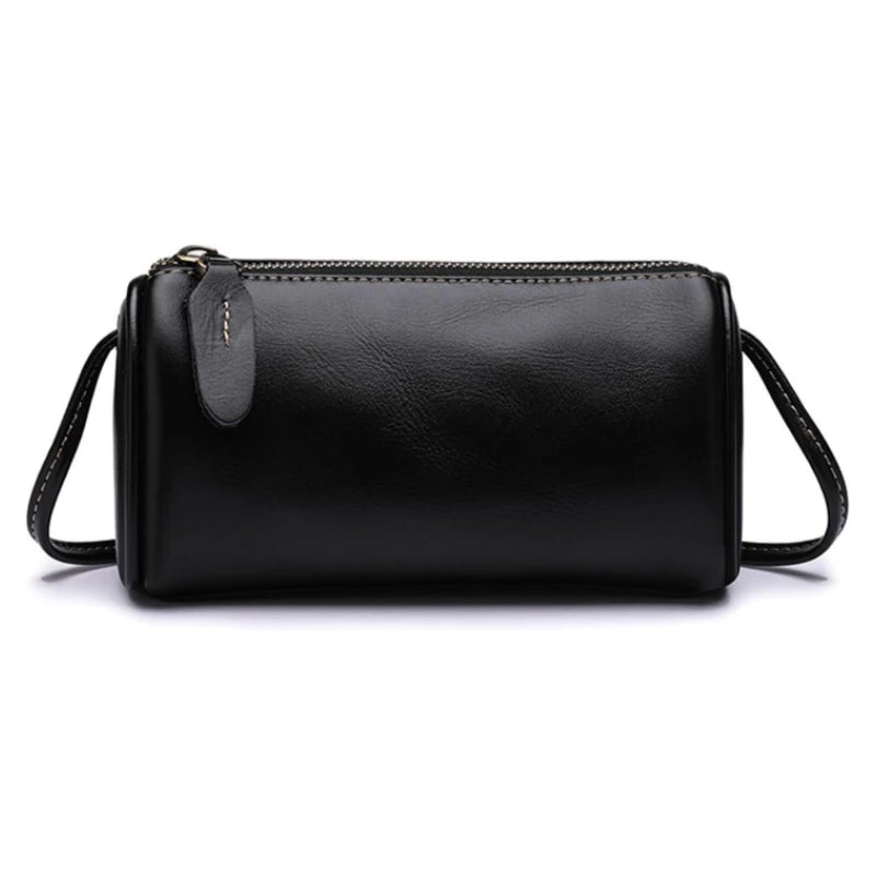 Eiyye Black Leather Crossbody Bag with a sleek barrel silhouette and minimalist style for daily essentials