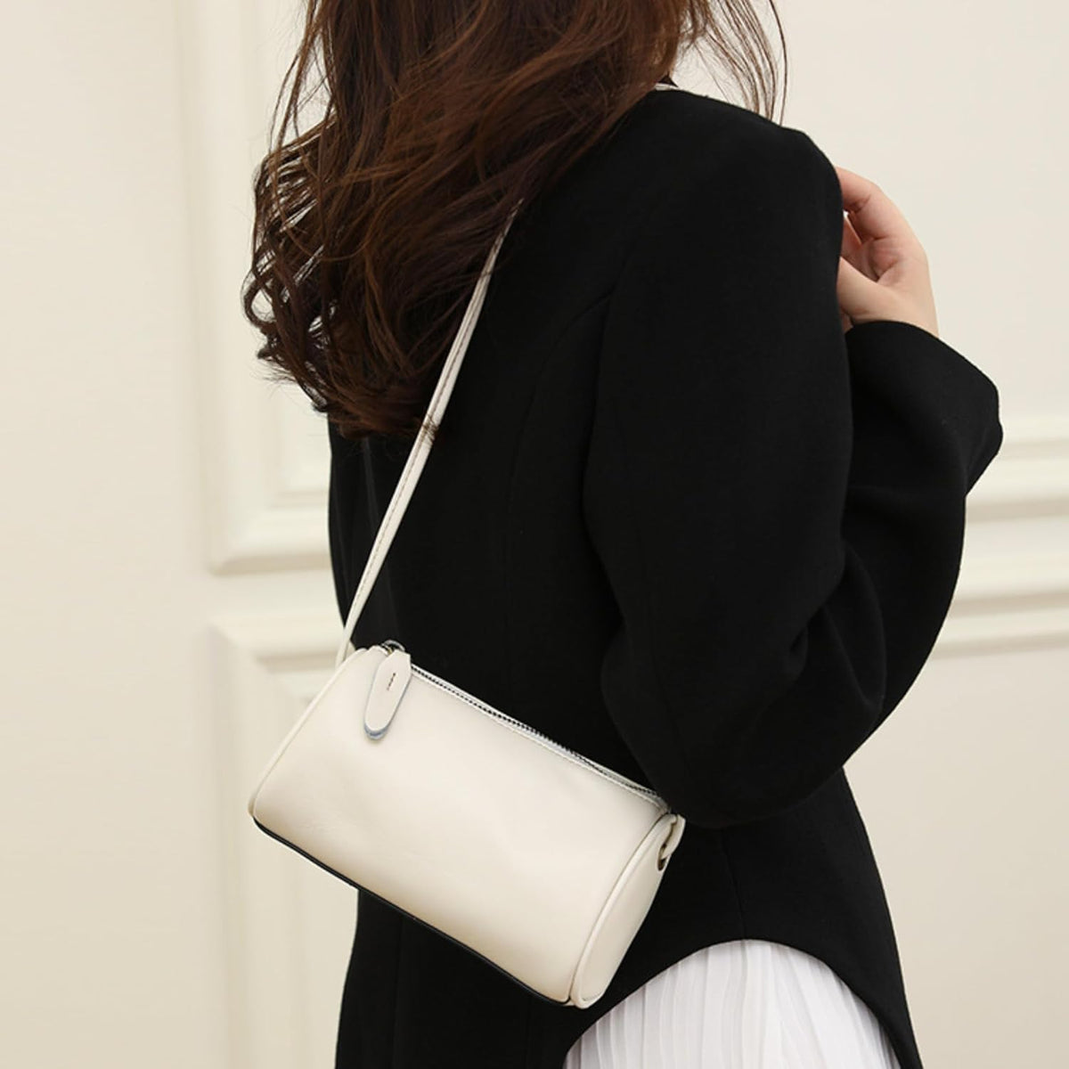 White Leather Crossbody Bag worn for a street look with a graceful shape and versatile styling appeal