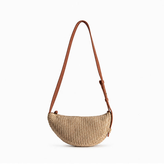 Eiyye Crossbody Bag with a woven crescent silhouette and adjustable strap for casual everyday carry