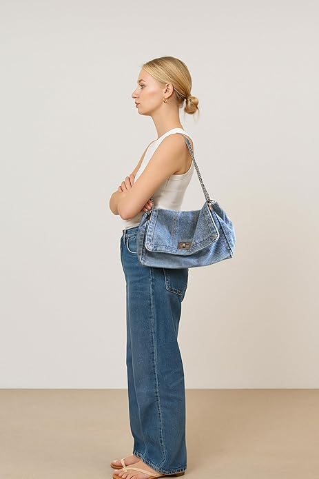 Eiyye Blue Denim Purse Worn on the Shoulder by Model Showing Side Profile and Vintage Style