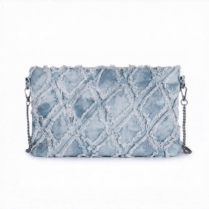 Woman carrying a denim chain shoulder bag for casual daily outfit